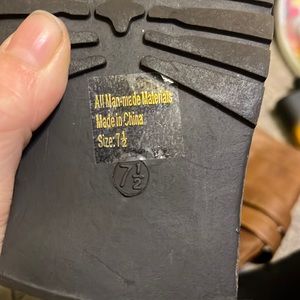 Tall brown laced up boots